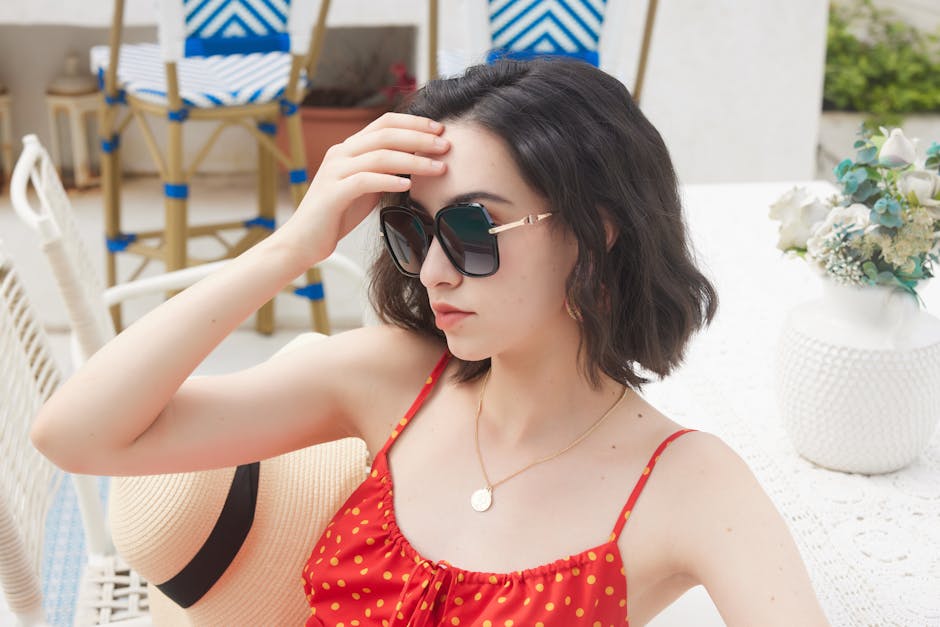 Fashionable woman in sunglasses enjoying summer style outdoors.
