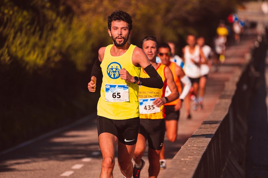 Athletic men running a marathon outdoors on a sunny day.